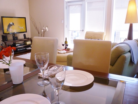 dining room with tv in background